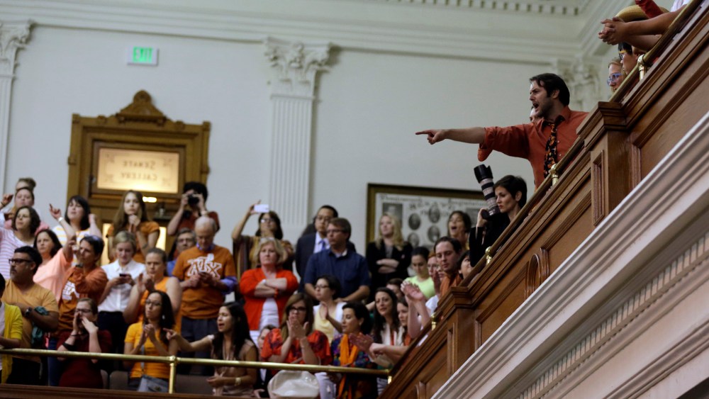 Members of the gallery cheer and chant as the Texas Senate tries to bring an abortion bill to a vote as time expires, Wednesday, June 26, 2013, in Austin, Texas.