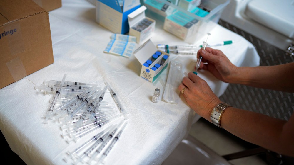 A public health nurse with the Knox County Health Department prepares to administer the measles, mumps and rubella (MMR) vaccine during an immunization clinic on May 28, 2014. (Photo by Noah Addis for NBC News)