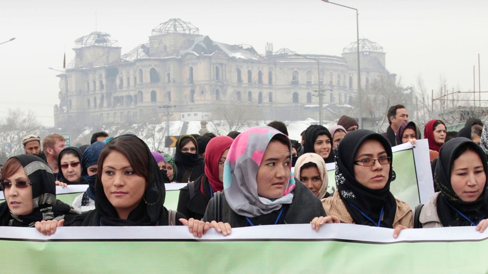 Dozens of Afghan activists marked Valentines Day by marching in Kabul to denounce violence against women. As the U.S. prepares to withdraw, Afghan women fear their rights will disappear. (AP Photo/Musadeq Sadeq)