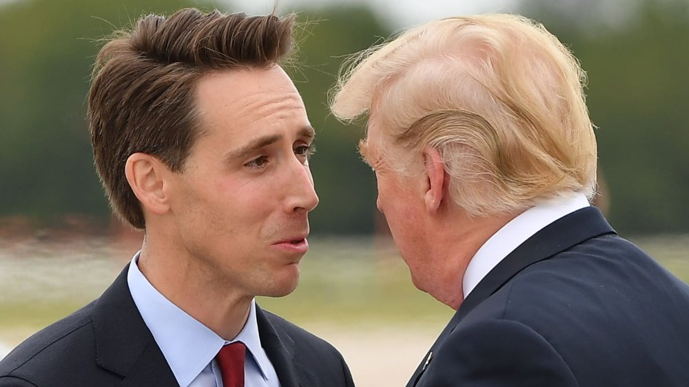 US President Donald Trump is greeted by US senatorial candidate Attorney General Josh Hawley upon arrival at Springfield-Branson National Airport in Springfield, Missouri on September 21, 2018.