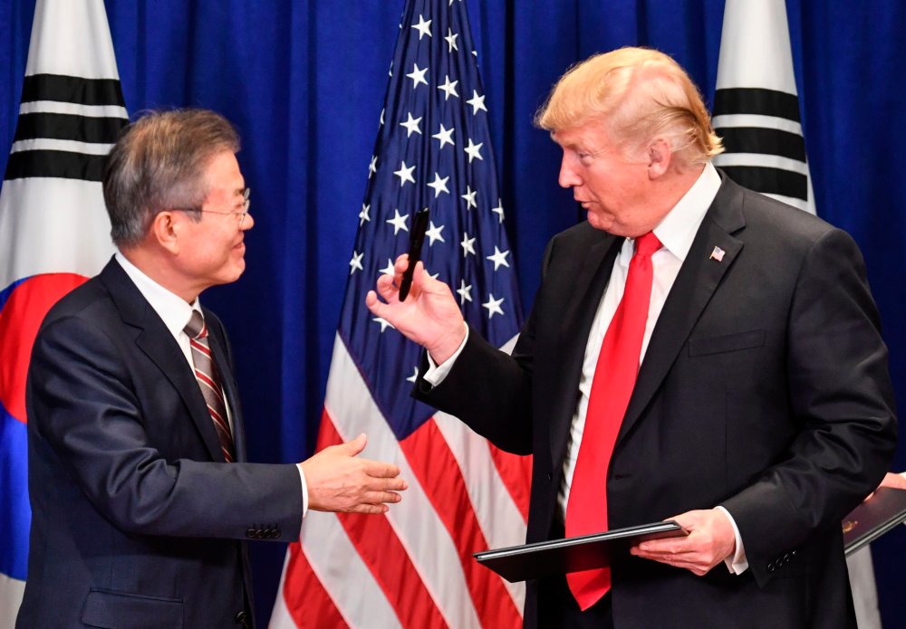 US President Donald Trump and South Korean President Moon Jae-in sign a trade agreement at a bilateral meeting in New York on September 24, 2018, a day before the start of the General Debate of the 73rd session of the General Assembly.
