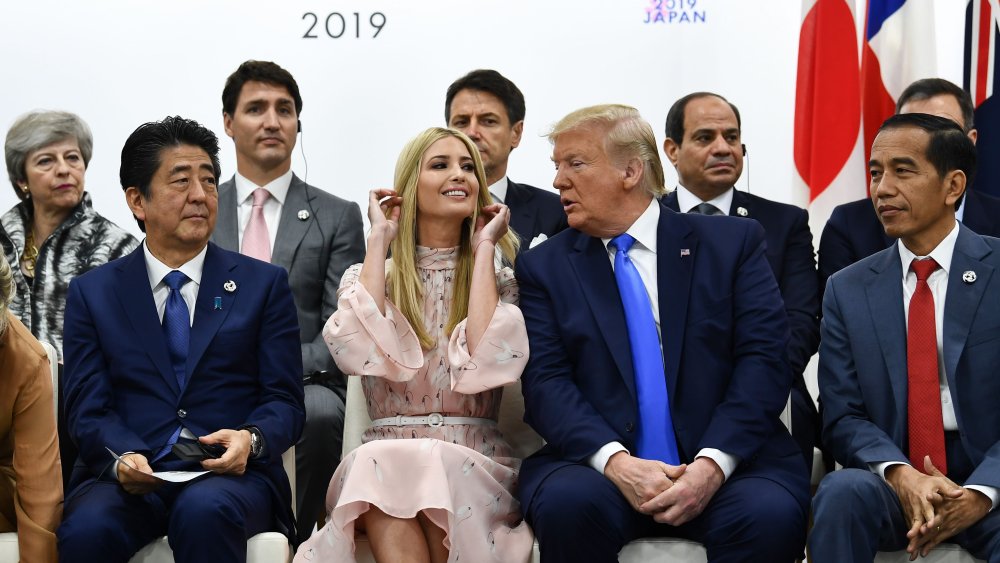 In this file photo taken on June 29, 2019 (front L-R) Japan's Prime Minister Shinzo Abe, advisor to the US President Ivanka Trump, US President Donald Trump and Indonesia's President Joko Widodo attend an event on women's empowerment during the G20 Summit