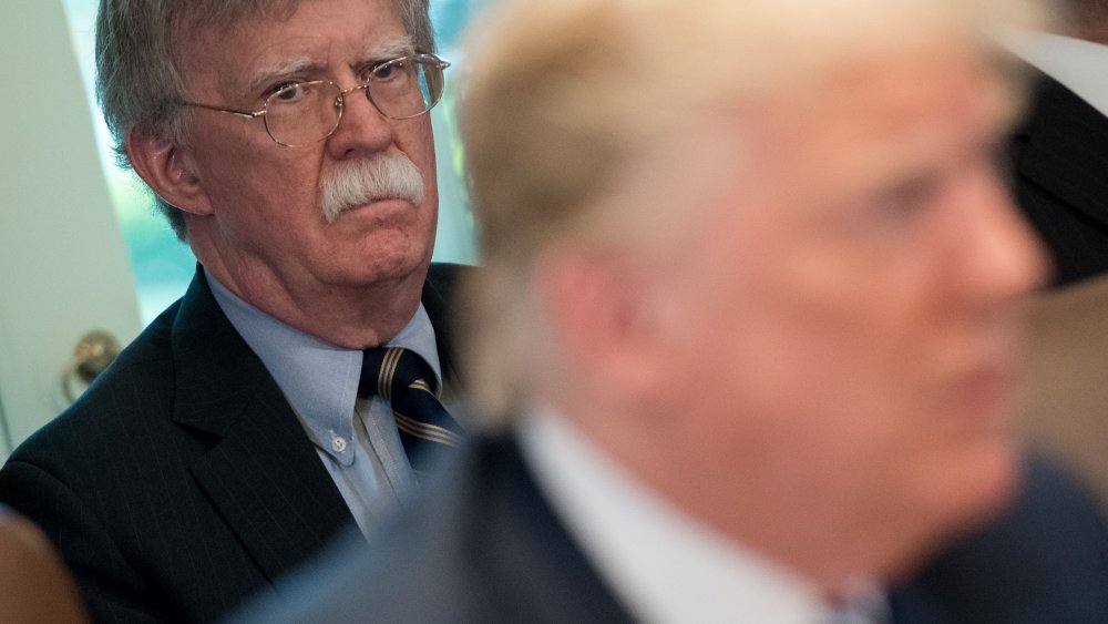 In this file photo taken on May 9, 2018, US President Donald Trump speaks alongside National Security Adviser John Bolton during a Cabinet Meeting in the Cabinet Room of the White House in Washington, D.C.