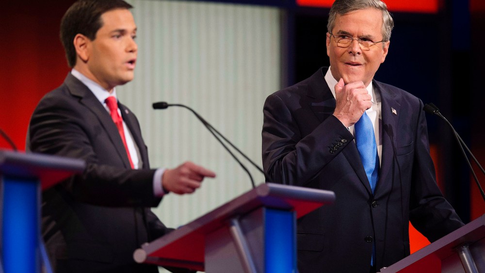 Republican Presidential candidate Florida Senator Marco Rubio speaks as former Florida Gov. Jeb Bush looks on during the debate at the Iowa Events Center in Des Moines, Iowa on Jan. 28, 2016. (Photo by Jim Watson/AFP/Getty)