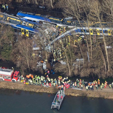 Firefighters and emergency doctors work at the site of a train accident near Bad Aibling, southern Germany, on Feb. 9, 2016. (Photo by Peter Kneffel/AFP/Getty)