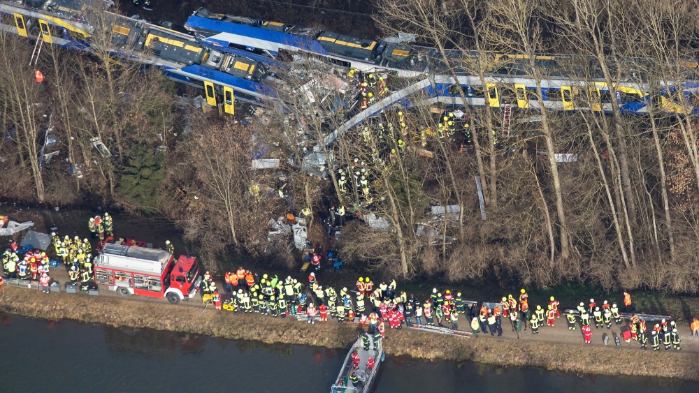 Firefighters and emergency doctors work at the site of a train accident near Bad Aibling, southern Germany, on Feb. 9, 2016. (Photo by Peter Kneffel/AFP/Getty)