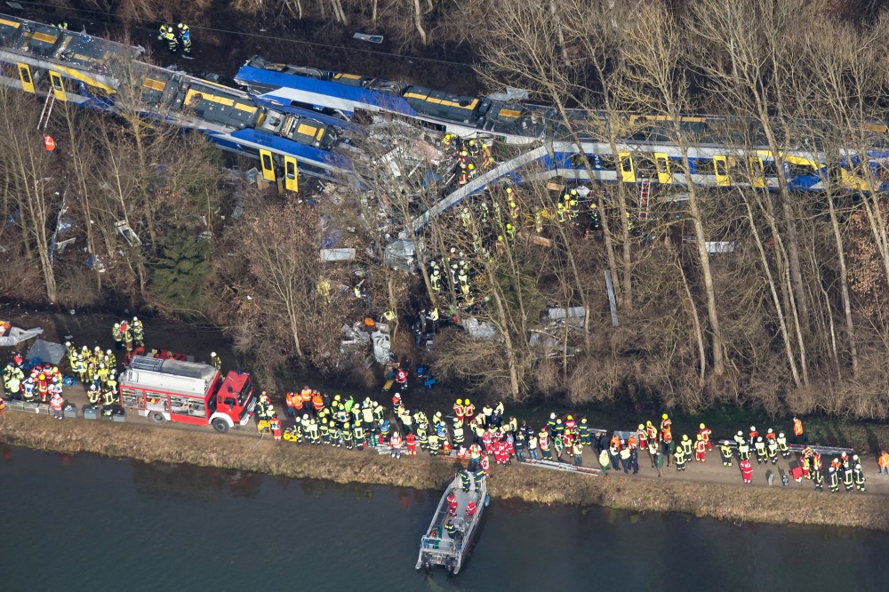 Firefighters and emergency doctors work at the site of a train accident near Bad Aibling, southern Germany, on Feb. 9, 2016. (Photo by Peter Kneffel/AFP/Getty)