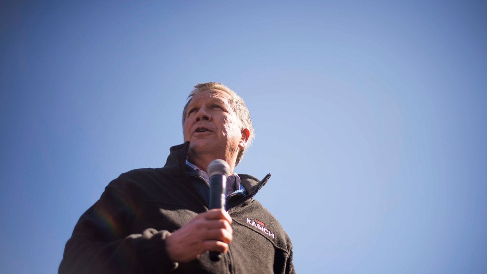 Republican presidential candidate John Kasich speaks outside Mutt's BBQ in Mauldin, S.C., on Feb. 13, 2016. (Photo by Jim Watson/AFP/Getty)