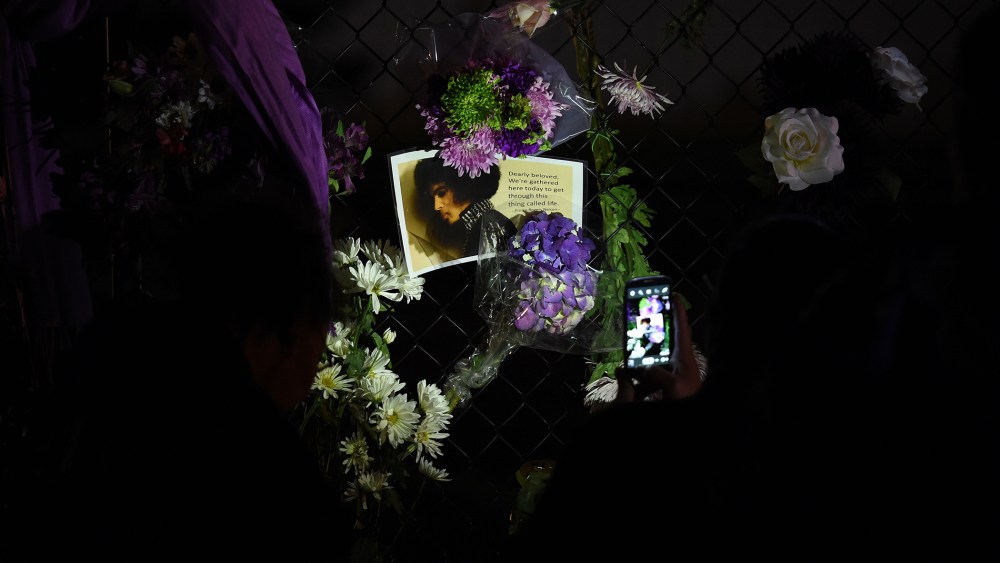 Fans pay their respects outside the Paisley Park residential compound of music legend Prince in Minneapolis, Minn., on April 21, 2016. (Photo by Mark Ralston/AFP/Getty)