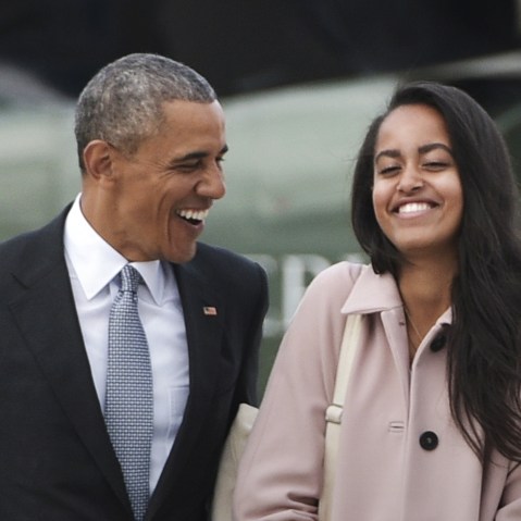 This file photo taken on April 7, 2016 shows President Barack Obama and daughter Malia make their way to board Air Force One. (Photo by Mandel Ngan/AFP/Getty)
