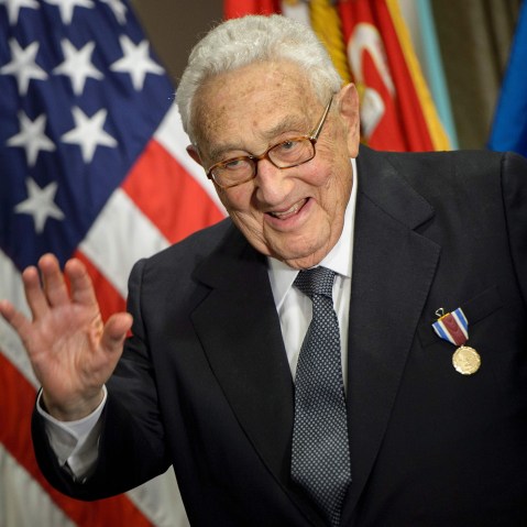 Former Secretary of State Henry Kissinger waves after receiving an award during a ceremony at the Pentagon honoring his diplomatic career May 9, 2016 in Washington, DC. (Photo by Brendan Smialowski/AFP/Getty)