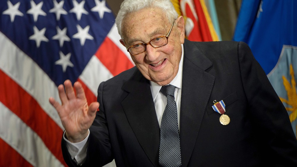 Former Secretary of State Henry Kissinger waves after receiving an award during a ceremony at the Pentagon honoring his diplomatic career May 9, 2016 in Washington, DC. (Photo by Brendan Smialowski/AFP/Getty)