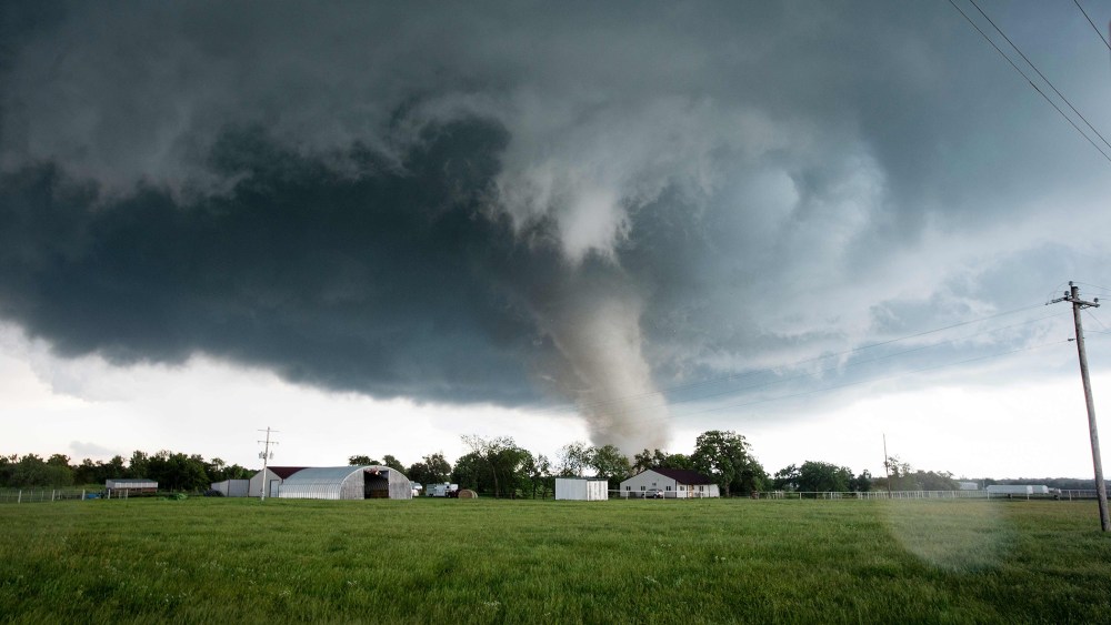 A tornado rips through a residential area after touching down south of Wynnewood, Okla., on May 09, 2016. (Photo by Josh EdelsonAFP/Getty)