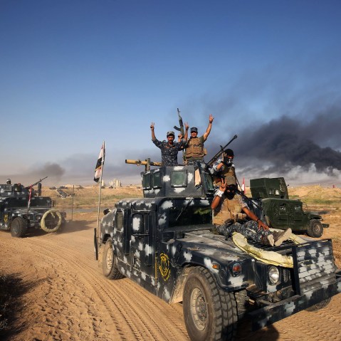 Iraqi pro-government forces advance towards the city of Fallujah on May 23, 2016, as part of a major assault to retake the city from Islamic State (IS) group. (Photo by Ahmad Al-Rubaye/AFP/Getty)