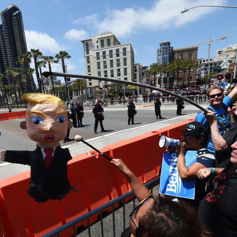 Protesters hit a piñata of republican presidential candidate Donald Trump as he speaks in San Diego, California on May 27, 2016. (Photo by Mark Ralston/AFP/Getty)