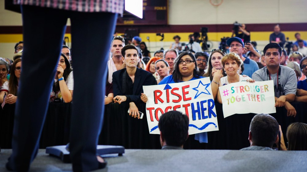 Supporters listen as Democratic presidential candidate Hillary Clinton speaks during a campaign rally at Sacramento City College on June 5, 2016 in Sacramento, Calif. (Photo by Gabrielle Lurie/AFP/Getty)
