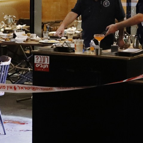 Israeli security forces inspect the site of a shooting attack in the coastal city of Tel Aviv on June 8, 2016. (Photo by Jack Guez/AFP/Getty)