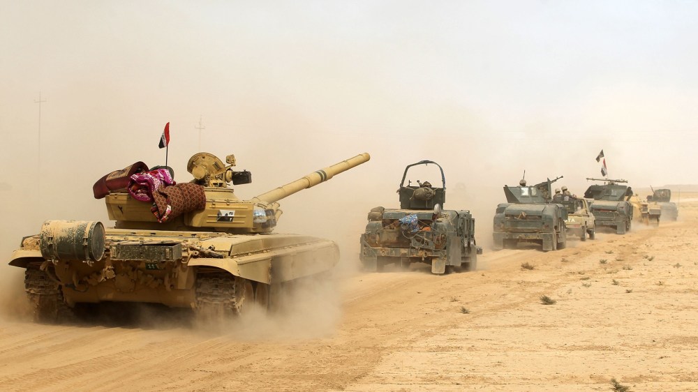 Iraqi forces deploy on Oct. 17, 2016 in the area of al-Shurah, some 45 kms south of Mosul, as they advance towards the city to retake it from the Islamic State group. (Photo by Ahmad Al-Rubaye/AFP/Getty)