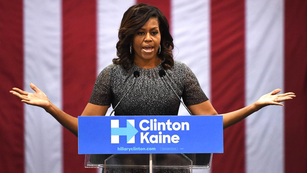 First Lady Michelle Obama speaks to a crowd of supporters as she campaigns for the Democratic Party presidential nominee Hillary Clinton at the Convention Center, in Phoenix, Ariz., on Oct. 20, 2016. (Photo by Mark Ralston/AFP/Getty)