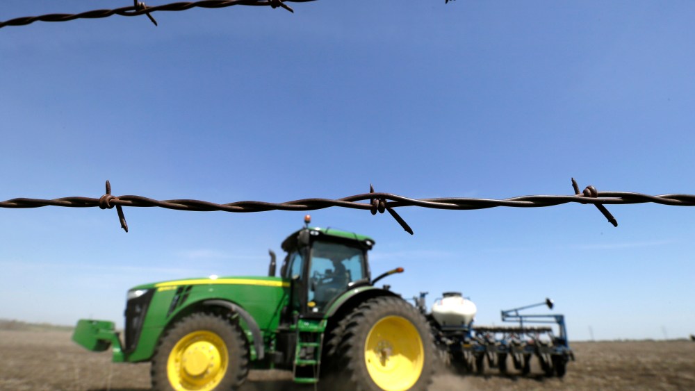A farmer plants corn in a field near De Soto, Iowa on May 5, 2014.