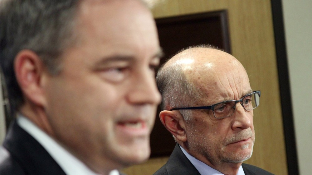Gov. Sean Parnell, left, and Health and Human Services Commissioner William Streur appear at a news conference in Anchorage, Alaska, on Friday, Nov. 15, 2013.