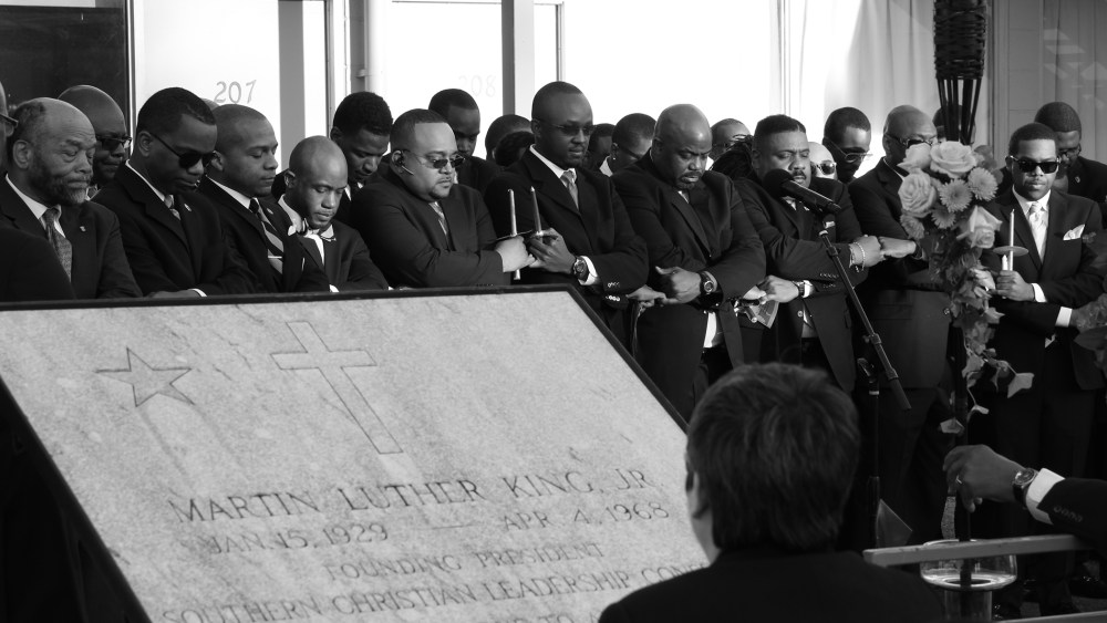Members of the Alpha Phi Alpha fraternity, Dr. Martin Luther King Jr.'s college fraternity, participate in a candlelight vigil to commemorate the 46th Anniversary of the assassination of King in front of the National Civil Rights Museum, April 4, 2014, in