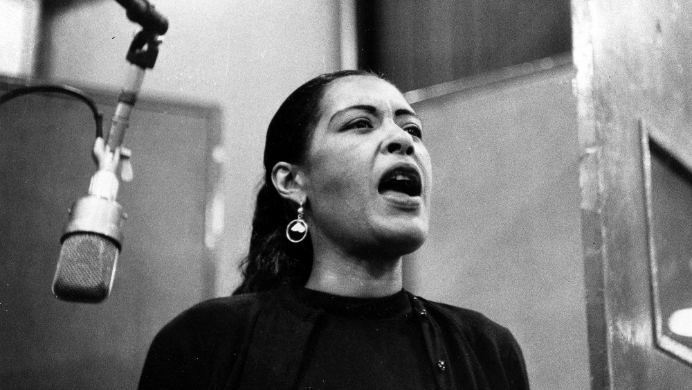 An undated photo of jazz singer Billie Holiday during a recording session.