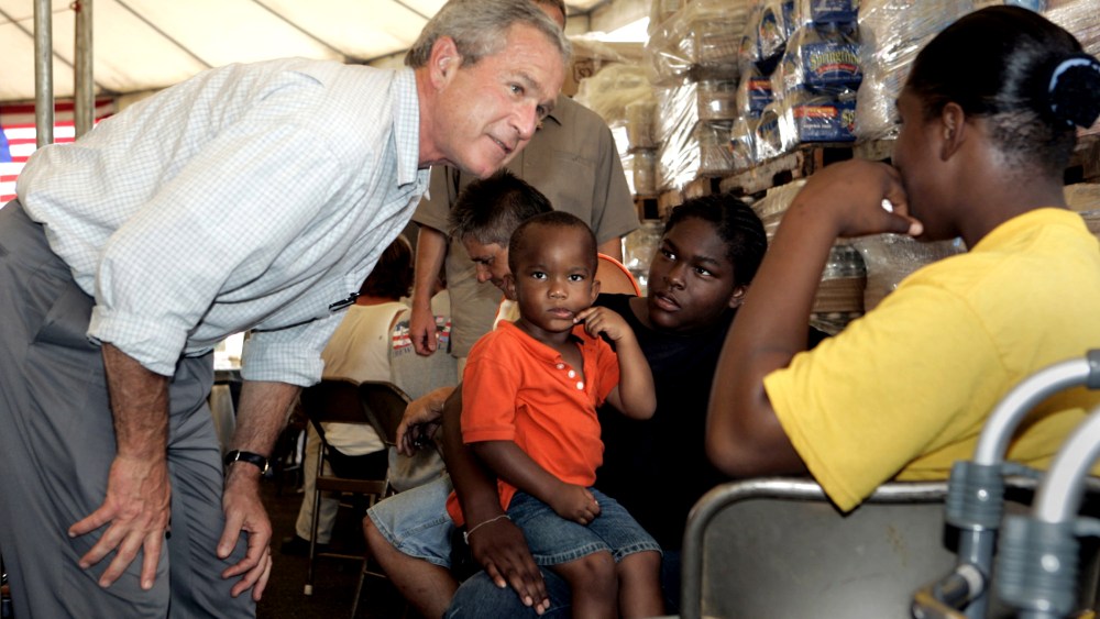 President Bush talks people at a food distribution center in Gulfport, Miss.