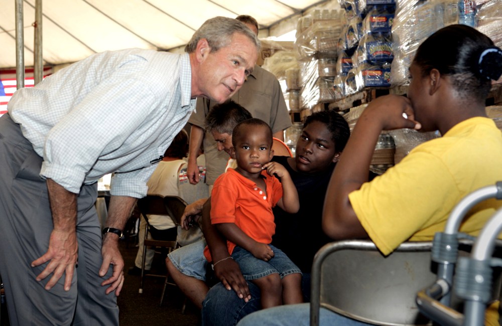 President Bush talks people at a food distribution center in Gulfport, Miss.