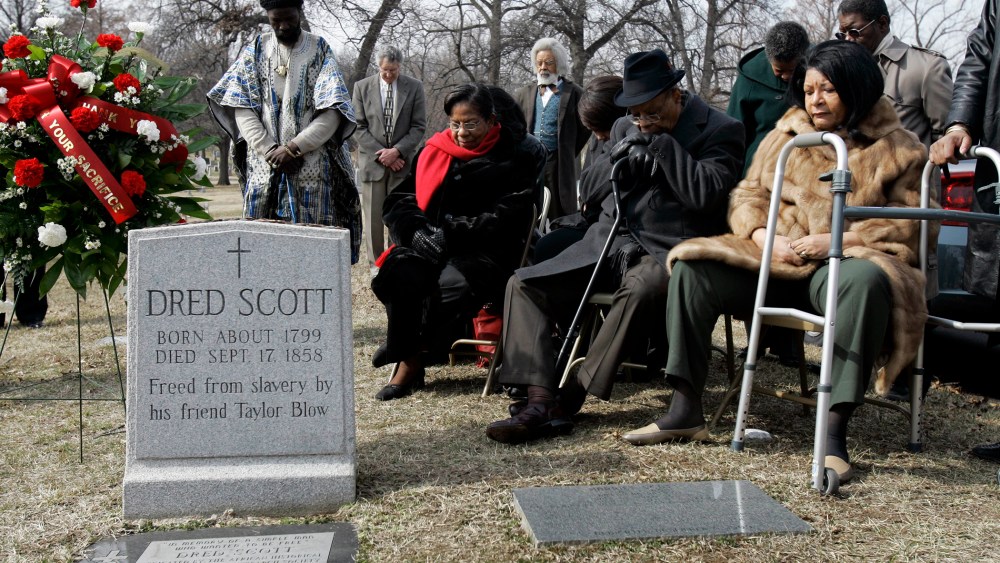 Descendants of Dred Scott and others gather at his grave site, in a, March 6, 2007 photo, at Calvary Cemetery in St. Louis, Mo.