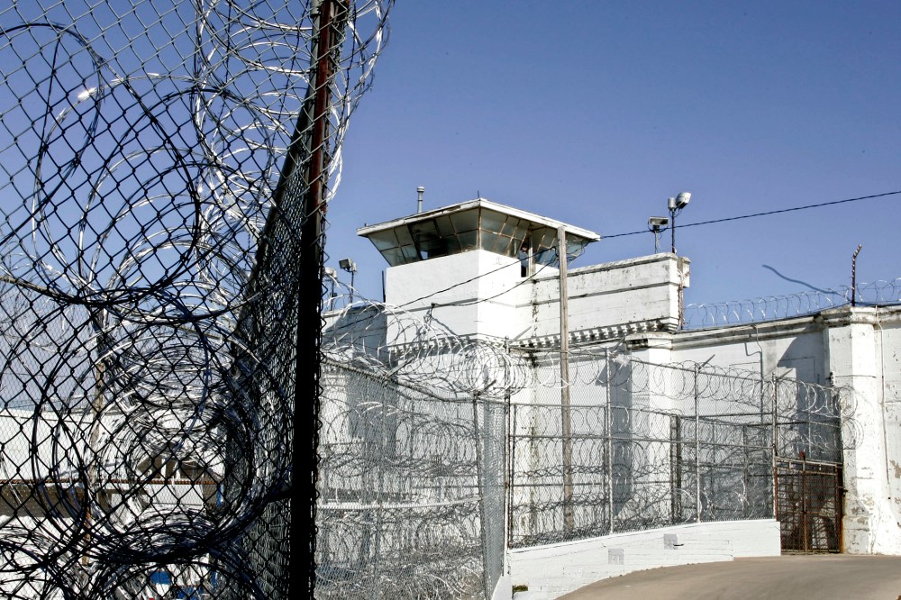 A guard tower and razor wire at the Oklahoma State Penitentiary in McAlester, Okla.
