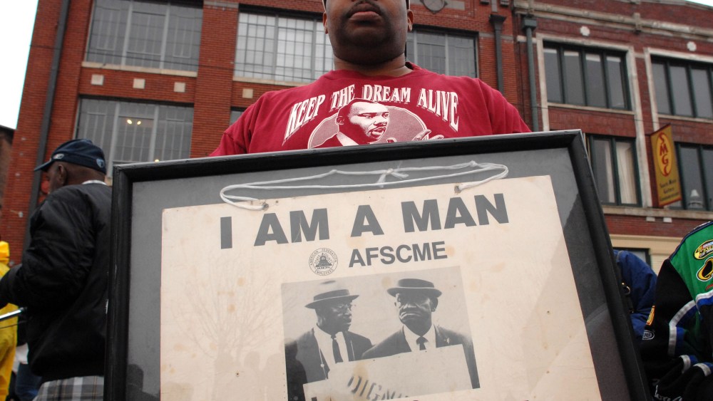 File Photo: Tim Waiters holds his uncle Jimmy's original sign from the sanitation worker's strike of 1968,  at the Recommitment March in Memphis, Tenn., Friday, April 4, 2008 on the anniversary of the assassination of Dr. Martin Luther King, Jr. The...