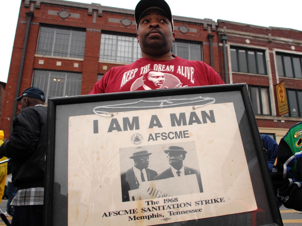 File Photo: Tim Waiters holds his uncle Jimmy's original sign from the sanitation worker's strike of 1968,  at the Recommitment March in Memphis, Tenn., Friday, April 4, 2008 on the anniversary of the assassination of Dr. Martin Luther King, Jr. The...