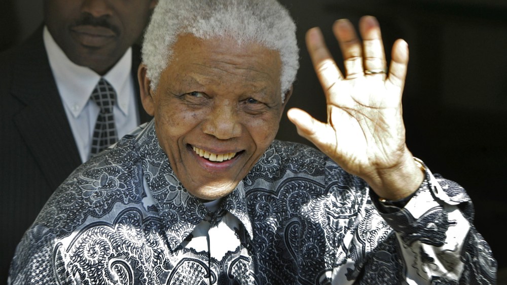 File Photo: Former South African President Nelson Mandela waves during The Mandela Rhodes Foundation  90th birthday celebration for the former president at one of his residence in Cape Town, South Africa, Wednesday, Aug. 20, 2008. (Photo by Schalk van...