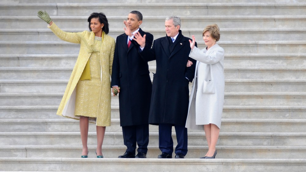 Left - right: Michelle Obama, President Barack Obama, Former President George W. Bush and Laura Bush wave as former Vice President Dick Cheney departs on the East Front of the Capitol after Obama was sworn in as the 44th President of the United States...