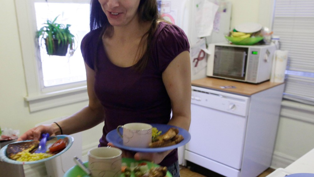 File Photo: Lisa Zilligen, 28, serves lunch for her three children at her home in Chicago, Nov. 23, 2009. Zilligen, a single mother and full time student at Loyola University has been getting food stamps for the past several months; sometimes the...