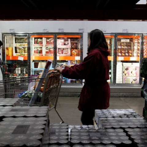 Shoppers peruse the frozen foods section at Costco in Mountain View, Calif. (Photo by Paul Sakuma/AP)