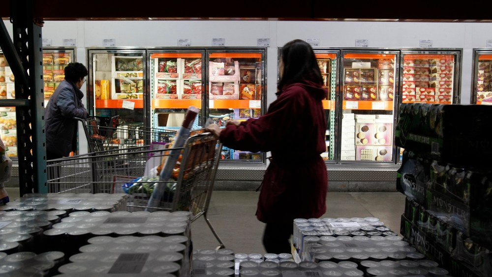 Shoppers peruse the frozen foods section at Costco in Mountain View, Calif. (Photo by Paul Sakuma/AP)