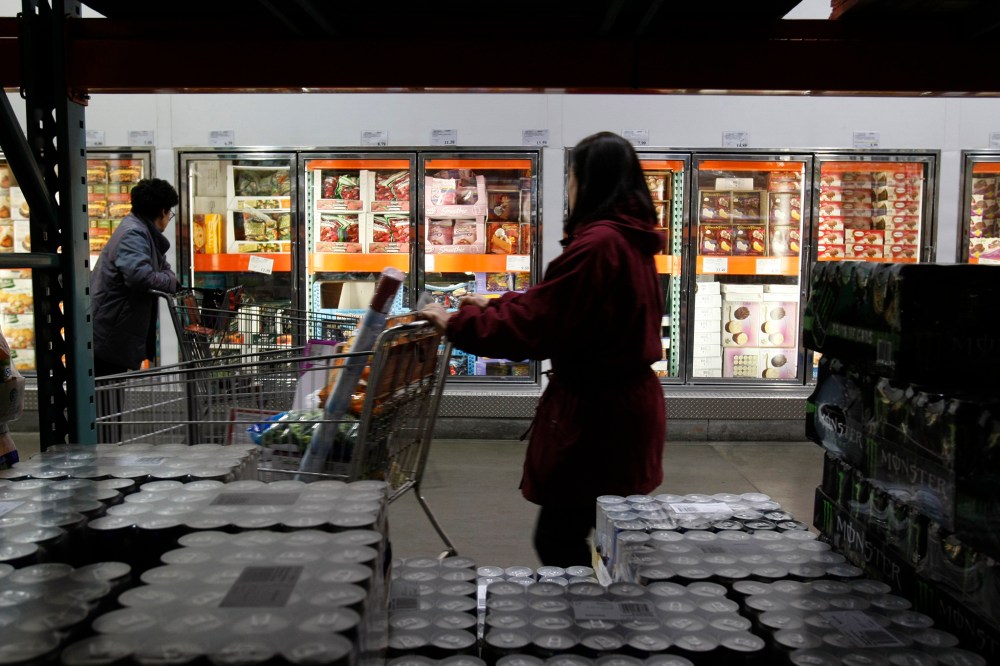 Shoppers peruse the frozen foods section at Costco in Mountain View, Calif. (Photo by Paul Sakuma/AP)