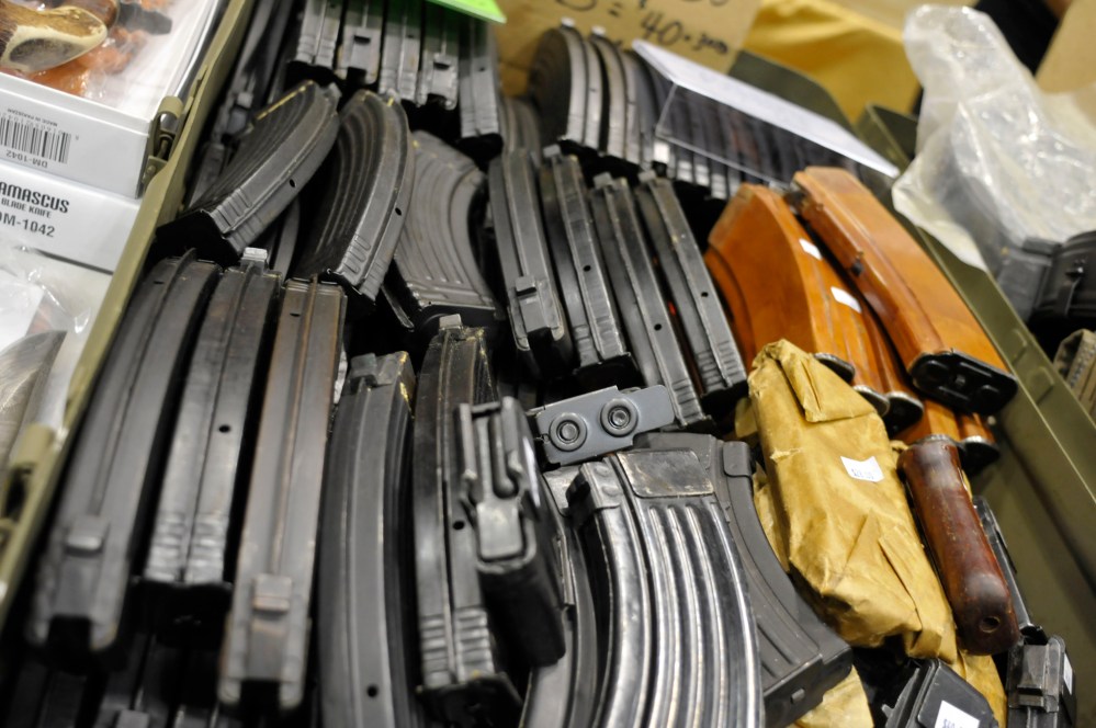 AK-47 assault rifle magazines fill a box at a gun and knife show in White Plains, N.Y., Saturday, June 19, 2010. (AP Photo/Swoan Parker)