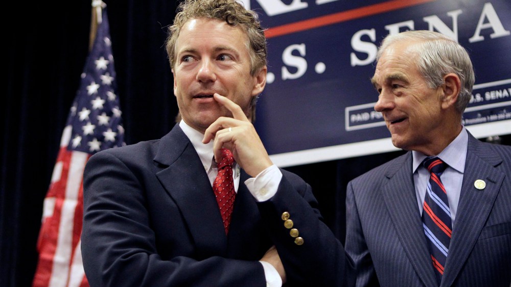 Rand Paul appears with his father U.S. Rep. Ron Paul during a campaign event in Erlanger, Ky. on Oct. 2, 2010. (Photo by Ed Reinke/AP)