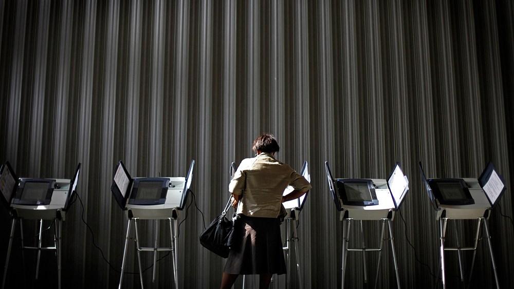 A woman casts her ballot during early voting, Oct., 26, 2010, in Atlanta, Ga.