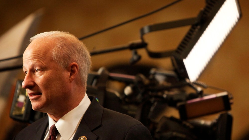 Rep. Mike Coffman, R-Colo., arrives early to talk with reporters during the Colorado Republican election night party at the Doubletree Hotel in Greenwood Village, Colo., Nov. 2, 2010.
