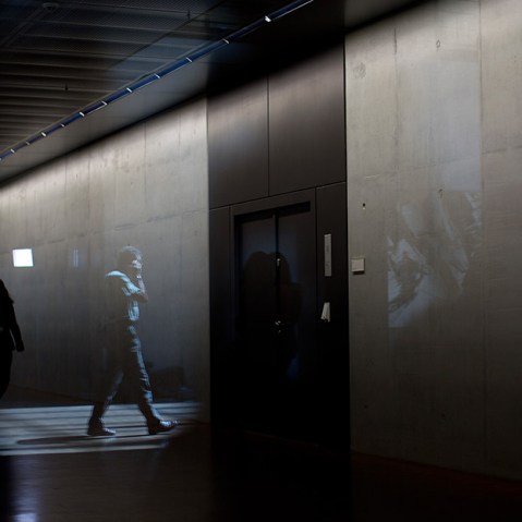 A man walks down the hall during the special meeting of the Parliamentary Control Panel on the spying affair in Berlin, Germany, 25 July 2013.  (Photo by Michael Kappeler/picture-alliance/dpa/A)