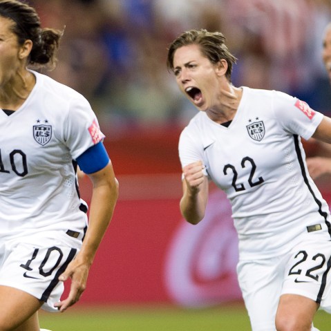 US team's Carli Lloyd (10) after scoring a penalty kick against Germany as Meghan Klingenberg (22) follows during a semifinal in the Women's World Cup soccer tournament, June 30, 2015, in Montreal, Canada. (Photo by Ryan Remiorz/The Canadian Press/AP)