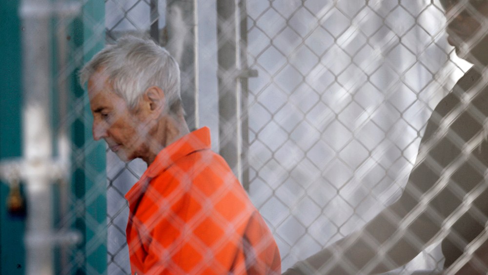 Robert Durst is escorted into Orleans Parish Prison after his arraignment in Orleans Parish Criminal District Court in New Orleans, March 17, 2015. (Photo by Gerald Herbert/AP)