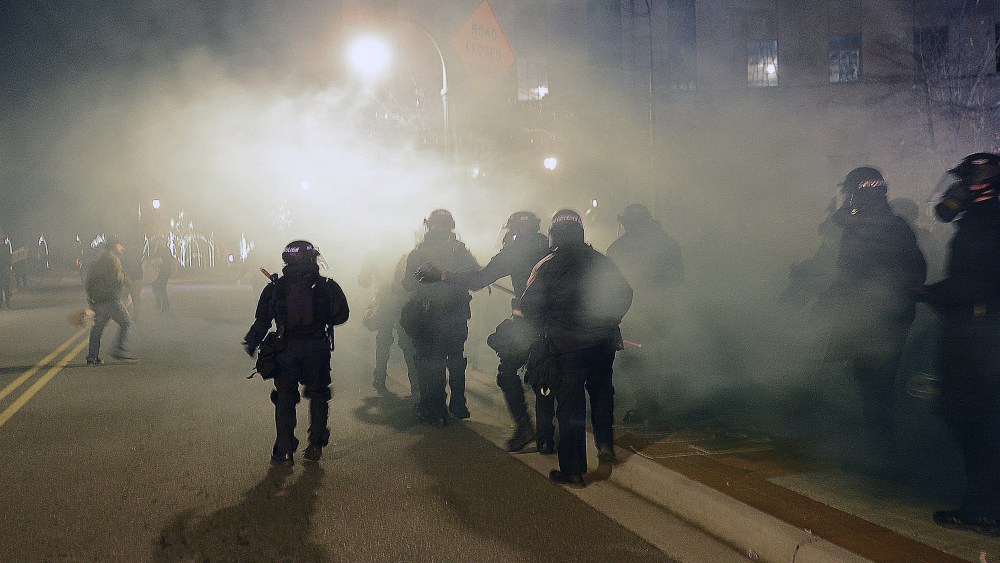 Officers in riot gear respond to a protest of the death of 17-year-old Jesus Huerta who died in police custody on Dec. 19, 2013, in Durham, N.C.