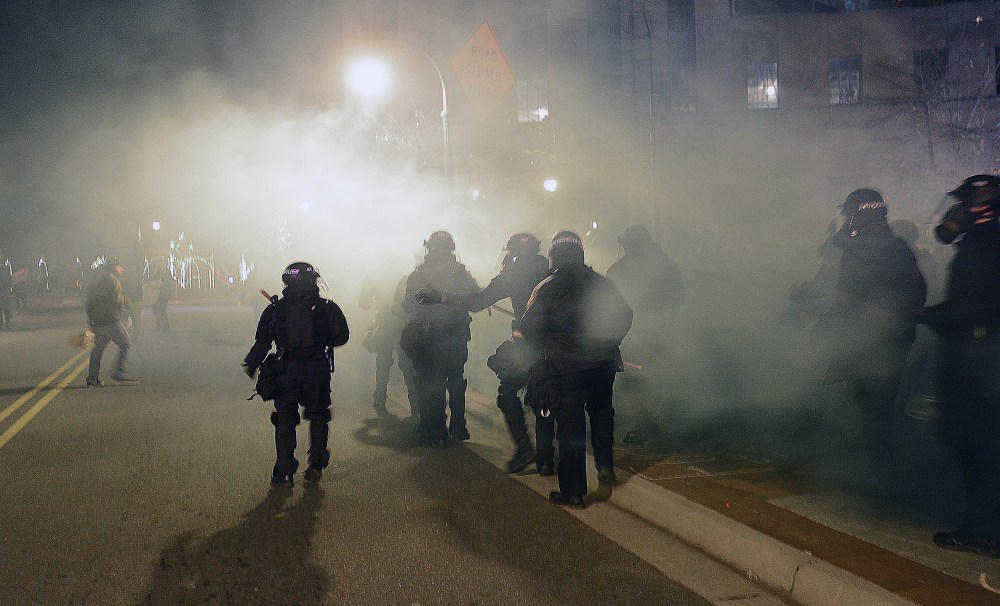 Officers in riot gear respond to a protest of the death of 17-year-old Jesus Huerta who died in police custody on Dec. 19, 2013, in Durham, N.C.