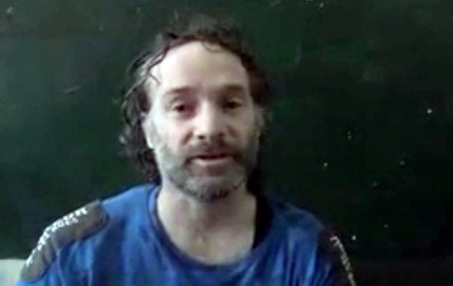 In this image made from undated video obtained by The Associated Press, which has been authenticated based on its contents and other AP reporting, a man believed to be Peter Theo Curtis, a U.S. citizen held hostage by an al-Qaida linked group in Syria, de
