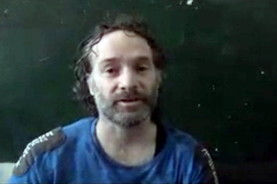 In this image made from undated video obtained by The Associated Press, which has been authenticated based on its contents and other AP reporting, a man believed to be Peter Theo Curtis, a U.S. citizen held hostage by an al-Qaida linked group in Syria, de
